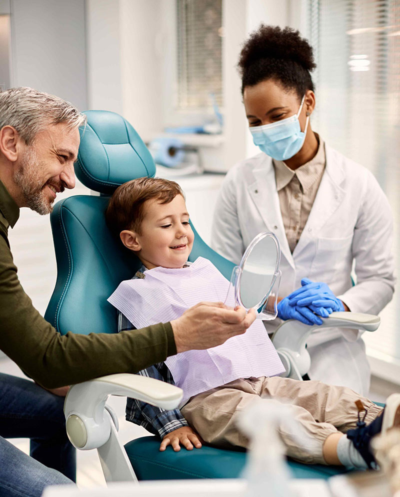 Child smiling during dental checkup